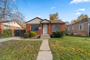 Bungalow-style home featuring brick siding