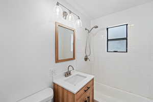 Bathroom featuring vanity and bathtub / shower combination