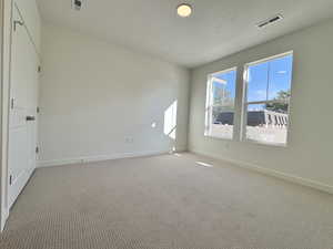 Unfurnished room with carpet floors and baseboards