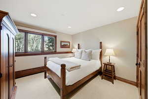 Bedroom featuring a closet, recessed lighting, and baseboard heating