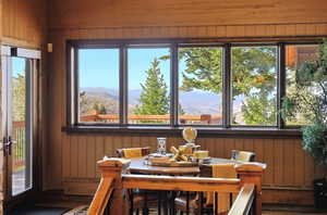Sunroom with a mountain view