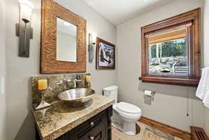 Bathroom featuring vanity and toilet