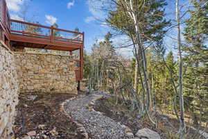 View of yard with a wooden deck