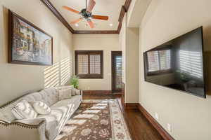 Living area featuring crown molding, hardwood / wood-style flooring, ceiling fan, and recessed lighting