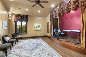 Living area featuring ceiling fan, wood finished floors, and recessed lighting