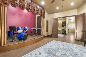 Bedroom with hardwood / wood-style floors, recessed lighting, and ceiling fan