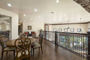 Dining area with dark wood-type flooring, recessed lighting, and ceiling fan