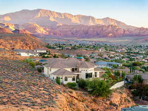 View of mountain background featuring nearby suburban area