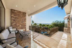 Balcony with a pool with connected hot tub