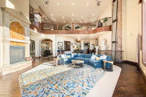 Common area with a high ceiling, recessed lighting, and stairway
