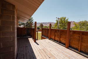 Wooden deck accessed via French doors in primary bedroom.