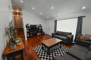 Living area with vaulted ceiling.
