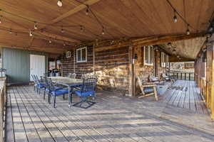 Wooden deck featuring outdoor dining area