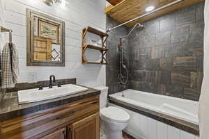 Bathroom featuring vanity and tiled shower / bath combo