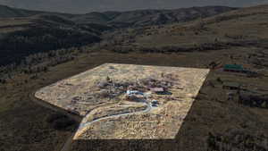 View of mountain background featuring rural landscape