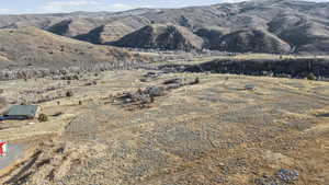 View of mountain backdrop featuring rural landscape