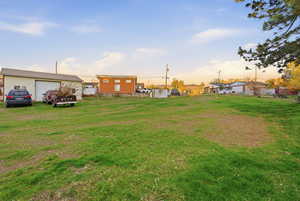 View of yard and exterior garage.