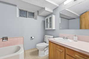Bathroom featuring a bath and vanity