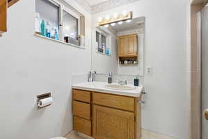 Bathroom with vanity and a stall shower