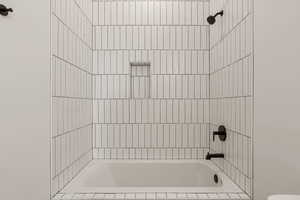 Bathroom featuring bathing tub / shower combination