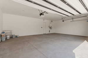 Garage featuring tankless water heater