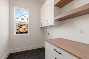 Laundry room featuring hookup for a washing machine and cabinet space