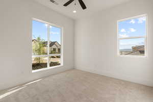 Spare room with light colored carpet, a ceiling fan, and recessed lighting