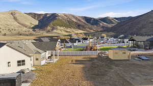 View of mountain backdrop featuring nearby suburban area