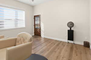 Living area featuring wood finished floors and baseboards