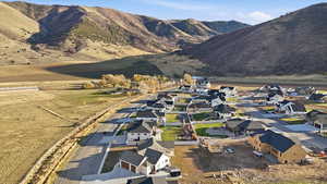 View of mountain backdrop with nearby suburban area