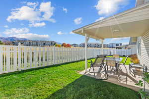 Fenced backyard with a patio and a residential view