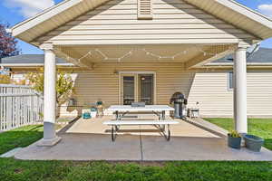 View of patio featuring grilling area and outdoor dining area