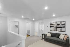 Living room with carpet and recessed lighting