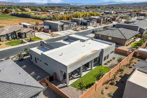 Aerial perspective of suburban area with a mountainous background