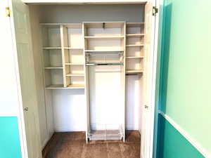 Bedroom 2 closet with custom shelving.