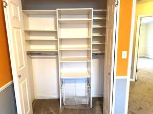 Bedroom 1 closet with custom shelving.