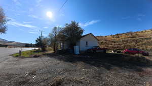 View of side of property featuring a mountain view