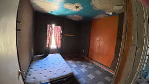 Bedroom featuring dark floors