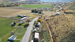 Aerial view of property's location with rural landscape and a mountain backdrop