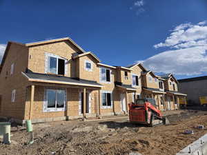 View of front facade with a residential view and covered porch