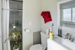 Full bathroom featuring toilet and vanity