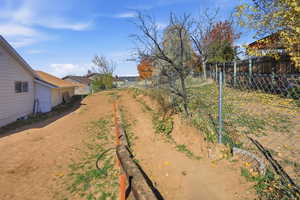 View of fenced backyard looking north