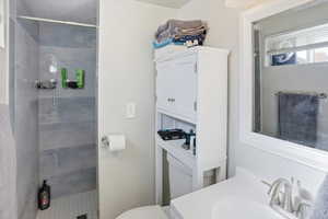 Bathroom with a stall shower and vanity