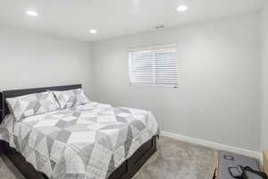 Bedroom featuring carpet and recessed lighting