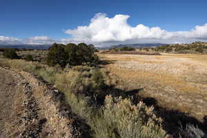 View of mountain backdrop featuring rural landscape