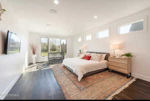 Bedroom with wood finished floors and recessed lighting