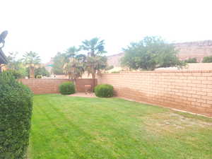 View of fenced backyard