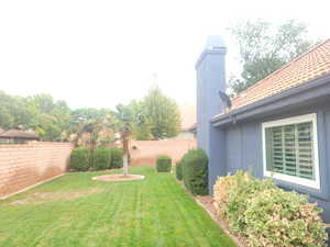 View of fenced backyard