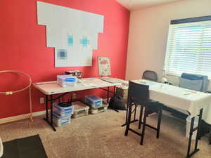 Carpeted office featuring baseboards