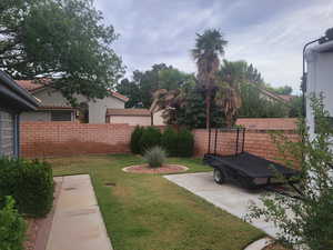 View of fenced backyard